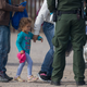 A young child is seen as she along with other migrants are processed by Border Patrol agents after being detained when they crossed illegally into the United States from Mexico on June 02, 2019 in Sunland Park, New Mexico.
